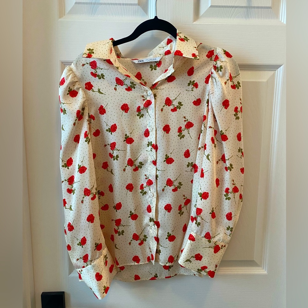 White collared button down blouse with shoulder pads
